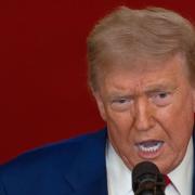 President Donald Trump speaks from the East Room of the White House (Carlos Barria/Pool/AP)