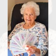 Sylvia celebrates a big play-money win at Snowdrop Place race night