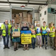 Matty Davitt, Driver and Operator for the Colten Group, third from left, at a handover of donated items at the New Forest for Ukraine sorting hub in Lymington. With him are charity volunteers, from left: Richard, Eileen, Jill, Jackie, Andrea and Sandra