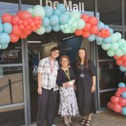 Claudete (centre) with her grandson John (left) and ESOL Lecturer Beth (right)
