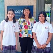Year 9 students Siri and Amitis with Thornden School headteacher Caroline Lowing
