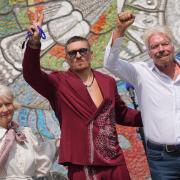 Ukrainian boxer Oleksandr Usyk and Sir Richard Branson with Vladyslav Chechotkin (right) and deputy mayor for culture and the creative industries Justine Simons, unveil the Kestrel Mosaic (Yui Mok/PA)