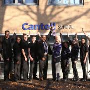 Cantell School’s deputy head Harry Kutty, head Ruth Evans and pupils celebrate their Ofsted report.