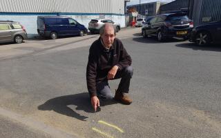 Mark Newland says double yellow lines outside his business will make the parking situation worse