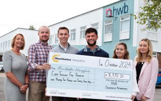 Caitlyn Sherry, Mountbatten Hampshire’s corporate partnership manager, received a cheque for the money at HWB's office