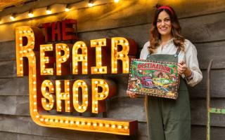 Rachel Lowe MBE holding the Destination The Repair Shop board-game