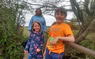 Hannah Foster and her two children, Henry and Emilia, on the bridge at Martin's Road, Brockenhurst