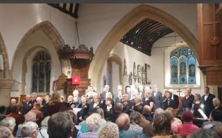 Meon Voices Choir thanks departing Chair for 10 years’ service as he helps raise £790 for two charities.