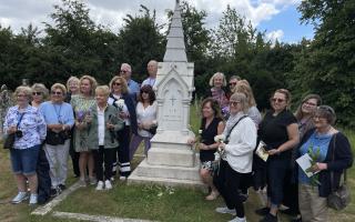 Nurses from Michigan lay flowers at Nightingale’s grave in Wellow