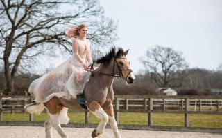 A bride riding her horse at her Langford Farm wedding