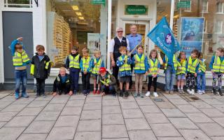 Youngsters don hi-vis vests after eye-care session at Lymington store