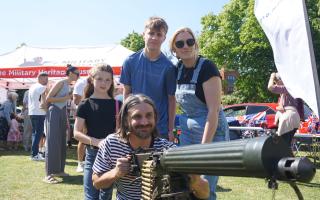 Peter Norris manning the machine gun with his family at the Eastleigh VE Day celebration