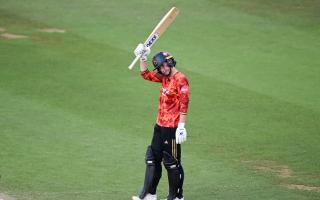 The Blaze batter Georgia Elwiss raises her bat on a fifty against Hampshire Hawks in the Women's Vitality Blast